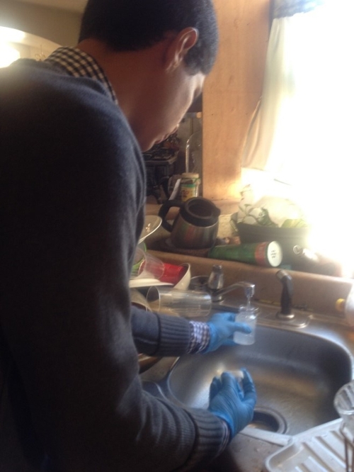 student testing water from the sink